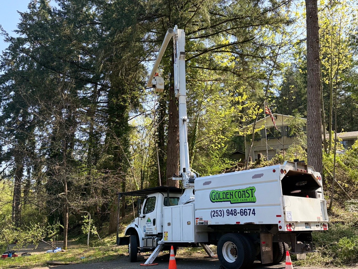 Golden Coast Tree Care bucket truck on a residential job