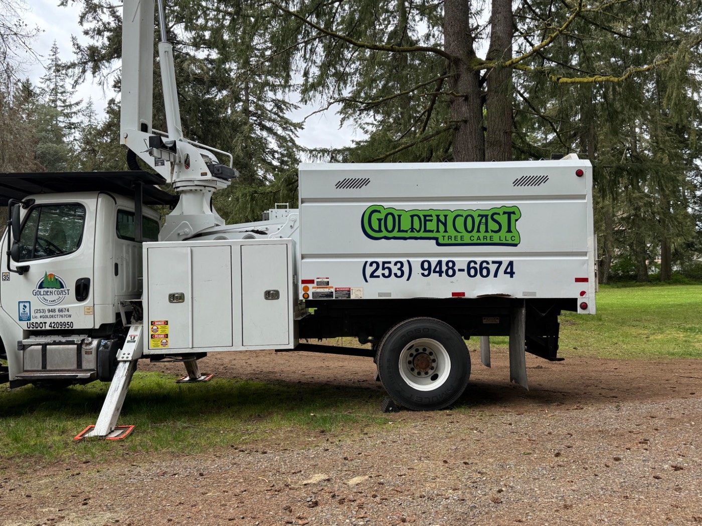 Golden Coast Tree Care chip truck with license number and BBB accreditation decal